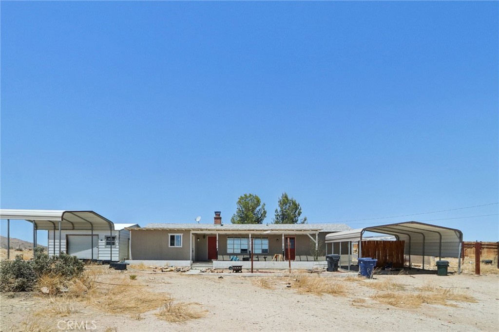 Located on a 5-acre parcel with approximately 1.2 acres fenced, this view property offers privacy, space, and functionality. The home features stainless steel appliances, an electric stove, and an electric water heater. The spacious living room includes a brick fireplace. There are two bedrooms and one full bathroom.
Exterior features include two carports, a detached garage with electrical on a concrete pad, multiple storage sheds, and drought-tolerant natural landscaping.
Ideal for buyers seeking land, views, and versatile outdoor structures!