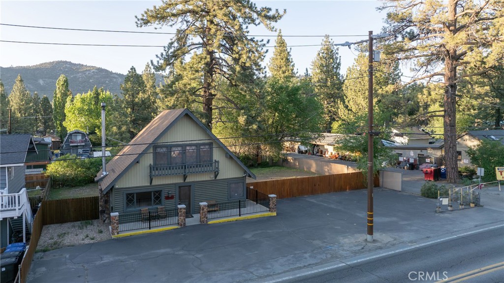 Prime Commercial Opportunity in a High-Traffic Location! This charming log construction building is perfectly situated on an oversized commercial lot, offering excellent exposure on a bustling boulevard. Ideal for a business looking to maximize visibility, this updated property has endless potential for expansion and growth. Step into the spacious main floor, where a large showroom welcomes you with abundant natural light streaming through generous windows. A wood-burning stove adds warmth and character, while a full-size kitchen and convenient 3/4 bath make it easy to create a comfortable workspace. A dedicated laundry area ensures everyday practicality. Upstairs, discover a sprawling loft complete with its own 3/4 bath and a large office area—ideal for flexible workspaces, meeting areas, or even additional showroom space. The fully fenced yard provides room to expand or customize your outdoor space to perfectly suit your business needs. With prime signage opportunities right on the boulevard, your business will have the exposure it needs to thrive. Located within walking distance to popular restaurants and the convention center, this property offers exceptional convenience for both employees and clients. Originally built as a residence, the structure’s unique charm blends seamlessly with its current commercial general/residental zoning, allowing for a wide range of uses and future development options. Don’t miss out on this rare chance to establish your business in a highly desirable and high-traffic area!
