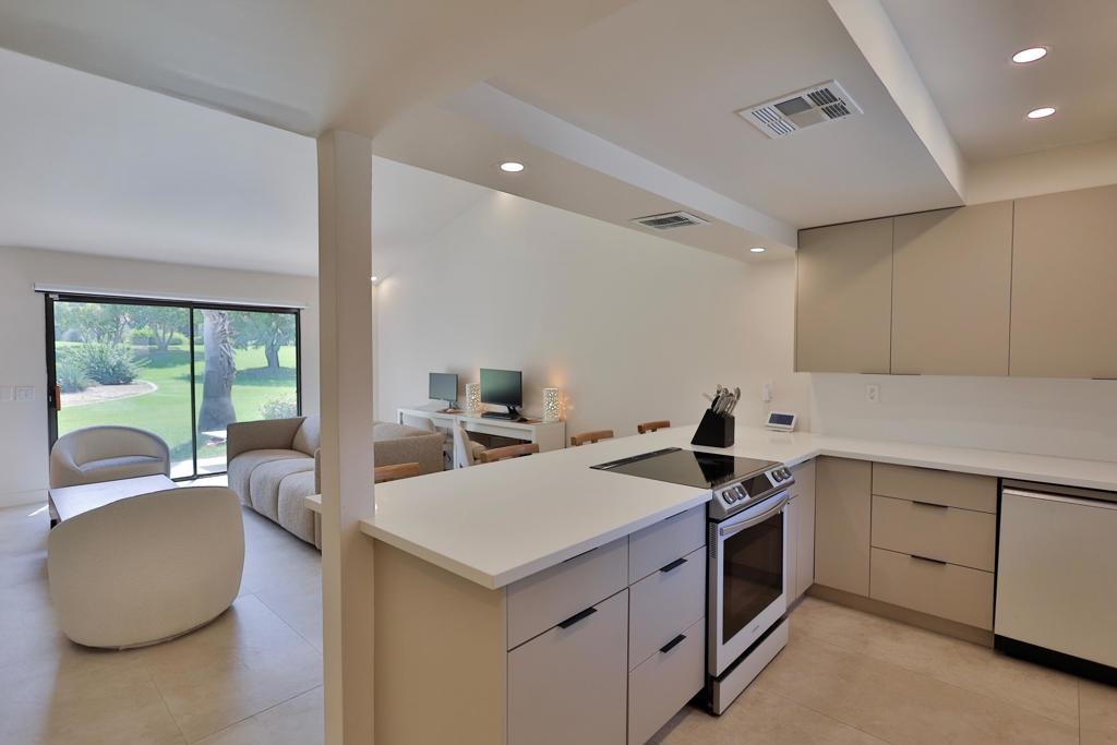Fully Renovated 1-Bedroom End Unit in Palm Desert Resort Country ClubLocated within the highly desirable Palm Desert Resort Country Club, this impeccably renovated 1-bedroom, 1-bathroom condo offers the ideal blend of comfort, style, and convenience. Featuring the sought-after Tradition floorplan, this single-level end unit delivers an efficient and spacious layout with stunning greenbelt and pool views.Step inside to discover a bright and open living and dining area, enhanced by high ceilings, large windows, and abundant natural light. The South facing patio seamlessly connects indoor and outdoor living, offering a peaceful retreat with beautifully manicured vistas.The completely redesigned kitchen boasts modern finishes, ample cabinetry, and a convenient breakfast bar -- perfect for everyday living or entertaining. The spacious primary suite includes direct patio access, a generously sized finished closet, and an elegant, step-free walk-in shower in the updated bathroom.Additional highlights include:Matching large-format tile flooring throughout. Attached covered carport. Quiet location on an interior circle and close proximity to the pools, spas, tennis, and pickleball courtsThis gated community offers 24-hour security, an 18-hole championship golf course, and a well-managed HOA that covers cable, internet, exterior maintenance, and landscaping.Whether you're looking for a full-time residence, seasonal escape, or investment property with strong rental potential, this home checks every box. Conveniently located near shopping, dining, and all major desert attractions.