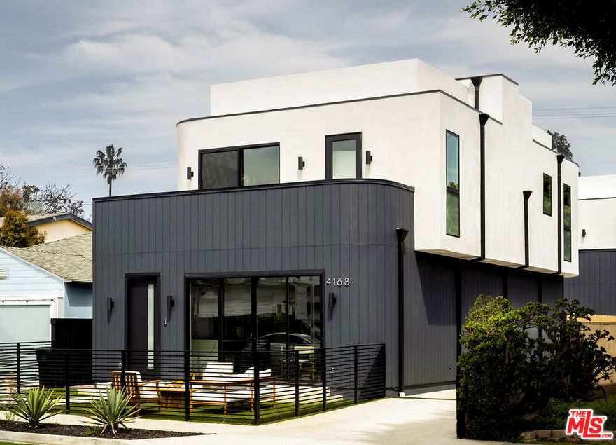 Introducing 4168 Mildred Avenue, a brand new 2025 construction located in the heart of Culver City. This front-facing single-family residence sits on a newly subdivided lot and features a fully enclosed front yard, providing both privacy and street presence. The rear residence just sold over asking, making this front home an exceptional opportunity in a high-demand market. Thoughtfully designed for modern living, the home offers 3 bedrooms, 3.5 bathrooms, and 2,290 square feet of meticulously crafted interiors. Wide-plank oak floors, custom cabinetry, and designer built-ins speak to the attention to detail throughout. The open-concept living and dining area is filled with natural light and extends effortlessly to a private patio through oversized sliding glass doors. The gourmet kitchen is equipped with top-of-the-line appliances, sleek oak cabinetry, and ample storage offering a perfect blend of form and function. A first-floor office adds versatility, easily serving as a fourth bedroom if desired. Upstairs, a spacious rooftop deck invites you to take in sweeping city views, ideal for relaxing or entertaining. A two-car garage completes the home with added convenience and storage space.