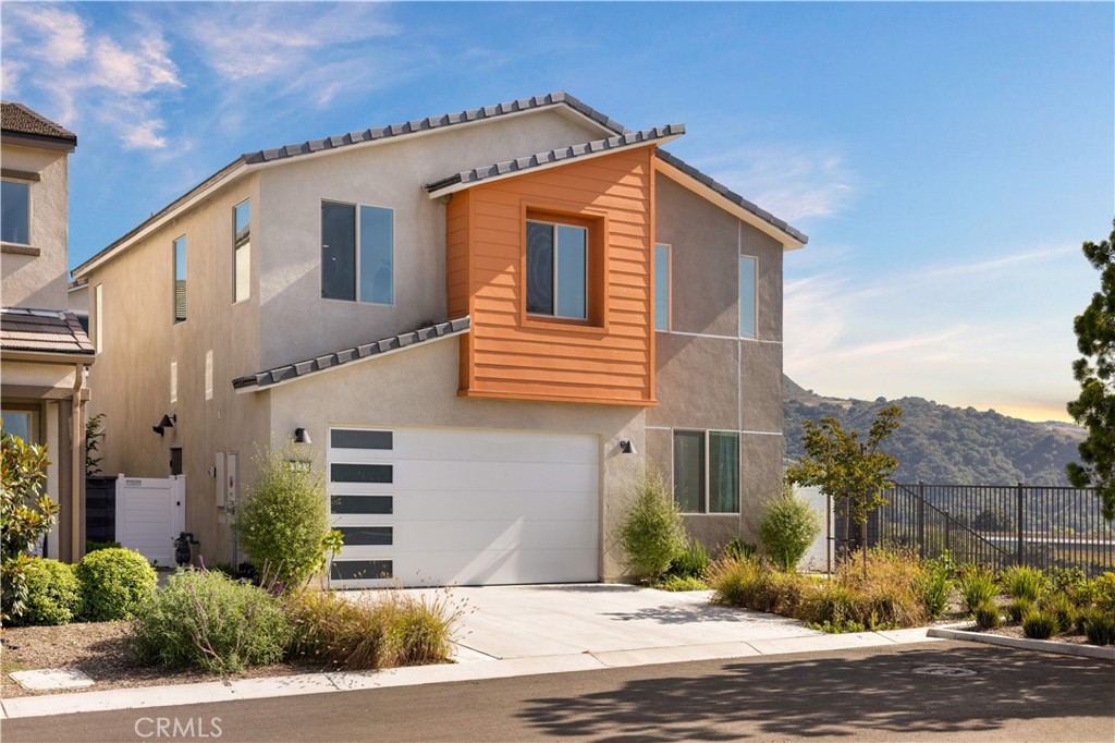 Breathtaking Views, Private Driveway, and Sunset Serenity – Welcome to 3173 Ivy Way. Perched on a premium corner lot in the scenic hills of Rancho Mission Viejo, this 4-bedroom, 3-bathroom home offers more than just space—it offers an experience. Wake up to sunrise over the canyon and wind down each evening with sunset views that make every day feel like a vacation. The beautifully landscaped backyard features a private spa, cozy seating areas, and the kind of serenity that’s hard to find in today’s market. Inside, you’ll find a modern open-concept layout with a large great room, a bright kitchen with stainless steel appliances and quartz countertops, and a versatile upstairs loft. One full bedroom and bathroom are conveniently located on the first floor. The primary suite offers mountain views, a spacious en-suite bath, and a large walk-in closet. Unlike many homes in the neighborhood, this property comes with its own full-length driveway—a rare feature that adds both curb appeal and convenience. This home blends comfort, style, and energy efficiency, including paid-off solar panels. Live where others vacation — with access to resort-style pools, top-rated Esencia K-8 school, Tesoro High School, fitness centers, community farms, coffee shops, tennis/pickleball courts, fire pits, and endless trails.