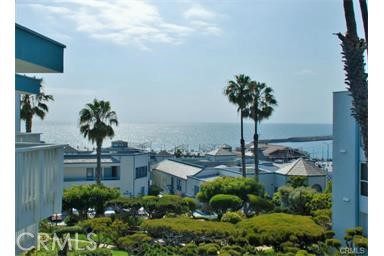 TOP floor TOTALLY REMODELED OCEAN VIEW CONDO Redondo Beach Pier adjacent. New everything and just completed! The Village Condominiums boast tons of amenities in a picturesque setting that includes two pools and hot tubs, fitness center, grills, fire pit, onsite laundry facilities, elevator, one car gated garage parking and electric car chargers. Experience resort style living at it's finest! Walk to Redondo Beach Pier, Harbor and restaurants. The living room and bedroom have ocean view balcony access through large sliding glass doors. This is a must see!