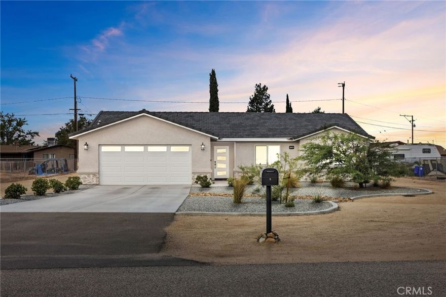 Welcome to this beautifully maintained single-story home located in the heart of Apple Valley! This 3-bedroom, 2-bathroom residence offers 1,523 square feet of modern living space with energy efficiency and low-maintenance design in mind.



Step inside to find an open floor plan filled with natural light, featuring a spacious living room that seamlessly connects to the dining area and kitchen, perfect for entertaining or family gatherings. The kitchen boasts sleek countertops, modern cabinetry, and stainless steel appliances.



The primary suite includes a private ensuite bathroom and generous closet space, while the additional bedrooms are ideal for family, guests, or a home office.



Enjoy year round comfort with paid off solar panels, helping you save on energy bills. Outside, the property showcases landscaping, a clean desert aesthetic, and a wide concrete driveway leading to a two-car garage.



Situated in a peaceful neighborhood, this home offers the perfect balance of tranquility and convenience, close to schools, shopping, dining, and commuter routes.