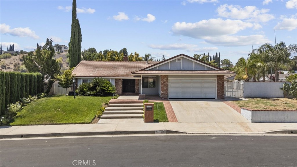 For lease in the heart of Porter Ranch this spacious 4 bedroom 2 bathroom home offers 2094 sq ft of well designed living space along with an attached garage for convenience. The interior is bright and inviting with a blend of natural and recessed lighting that highlights the warm laminate floors and the cozy fireplace in the living room. A separate dining area creates the perfect setting for gatherings and everyday meals.
The full kitchen is a standout feature with sleek modern cabinetry stainless steel appliances and a range hood for a professional touch. Ample counter space makes meal preparation easy and functional. Each bedroom is generously sized and includes built in closet space providing excellent storage options. The bathrooms feature high quality finishes and a modern design for a comfortable everyday experience.
Outdoors the large backyard is perfect for relaxation and entertainment. An open covered patio offers a shaded space for dining or lounging while the sparkling pool and spa hot tub create a private retreat for year round enjoyment. This home combines comfort style and functionality in a prime Northridge location close to shopping dining schools and commuter routes.