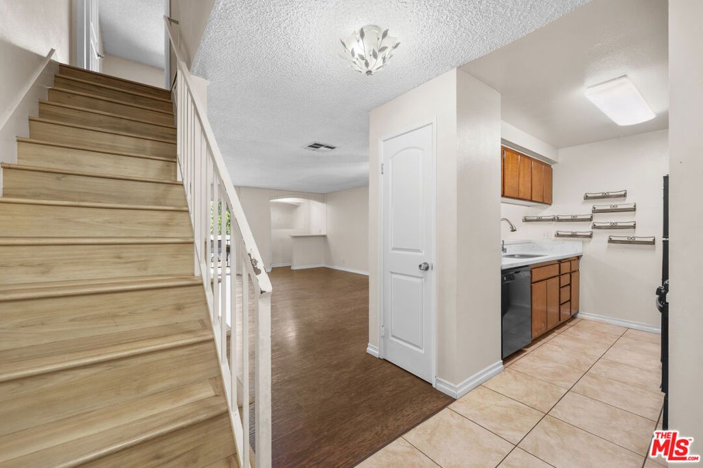 Photo of 21219 Roscoe Boulevard #211, Canoga Park, CA 91304 (MLS # 25613243)