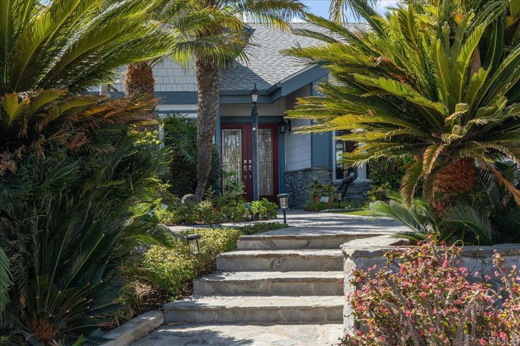 Lake San Marcos luxury views abound in this light and bright, window-lined golf course home on the 14th fairway of the Links at Lakehouse championship course. Soak up the sprawling vista of a blanket of green surrounding a majestic olive tree and peaceful pond just beyond. Enter in to the wide open living room under vaulted ceilings (and under a new roof!), enjoy a gas fireplace and the simple elegance of the upgraded luxury vinyl plank flooring and the natural flow of this well-planned layout. The remodeled kitchen has new cabinets, large gathering island with storage and bar seating, extra-large pantry, dining nook, Bosch dishwasher, new LG refrigerator, wine fridge and raised ceilings. Wander out to the huge wrap-around patio off the kitchen and under the tall, automated patio cover and experience those beloved breezes so coveted by those who live here at the lake. Sunset sits-and-sips out here are dreamy and are just a taste of the joy-filled days you will delight in among all the Lake San Marcos resort activities. Back inside, a large dining room beckons you for meals and memory-making while gazing through the bay window at the lush, yet low maintenance and private, front yard. The primary bedroom is large with a spacious ensuite bathroom, two walk-in closets and a bonus room/office/sunroom adjacent to the primary. A large, 2-car+golf cart garage with wonderful workbench and several tall storage closets lining the walls, plus pull-down attic storage, will woo the hobbyist and win over the future homeowner who loves optimal storage and organization for all their treasures! There is no HOA fee here, despite the resort life you'll be living! You can, however, choose to opt in, for a low annual fee, to the lake & lodge benefits of two pools, pickleball & tennis courts, boat rentals, discounts at the hotel, and more!