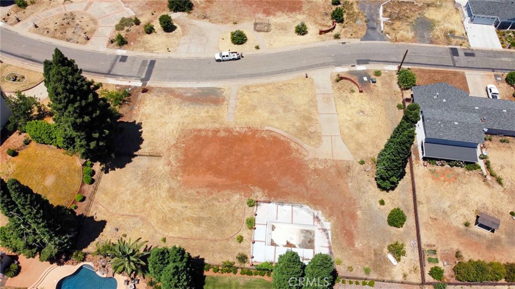 Breathtaking views with the convenience of a truly buildable flat lot - a rarity compared to the many steep hillside lots with less usable space. This fantastic parcel is ideally located in the highly desirable Valley Ridge Loop in Paradise, CA. Perched above it's neighbors maximizes the magnificent views including Butte Creek Canyon. This is one of the few in the neighborhood offering views of both Sunrise & Sunset. Imagine yourself relaxing on the porch with your favorite beverage, taking in the beauty. Take a drive through Valley Ridge Loop and see your home building Dreams become Reality. Encompassing nearly 7/10ths of an acre, this parcel includes essential amenities such as a water meter, natural gas connection, septic system, and available power supply. Perfect for building your dream home and embracing all that Paradise has to offer! The engineering & retaining wall for the pool are still present. The integrity of the full extent of the pool/plumbing & septic are undetermined since the fire. The seller has obtained Debris Removal Clearance. Lot Size and other information taken from county records, buyer to verify all information to satisfaction.