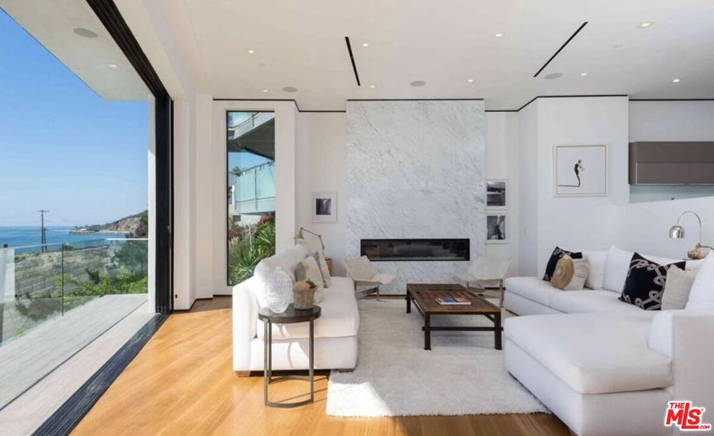 Modern Coastal Elegance with Unrivaled Ocean Views. Poised above the Pacific with sweeping, unobstructed 180-degree ocean views, this striking architectural residence blends sophisticated design with effortless coastal living. A statement of modern elegance, the home welcomes you through a grand pivot door and into a light-filled interior defined by clean lines, soaring ceilings, and seamless indoor-outdoor flow. Designed to maximize its commanding setting, every room captures panoramic ocean views through walls of glass. The open-concept floor plan includes 4 spacious bedrooms, 4.5 impeccably appointed baths, and a private elevator for ease of access across all levels. The gourmet kitchen is a true show piece featuring Sub-Zero and Wolf appliances, Bosch dishwasher, wall-mounted espresso machine, dual workstations, and a temperature-controlled wine cellar all centered around a dramatic oversized island. Ideal for both intimate dinners and grand-scale entertaining, the living and dining areas open to expansive outdoor terraces through disappearing glass doors. The primary suite is a private sanctuary, offering breathtaking views, direct terrace access, and a spa-like bath experience. Every finish has been thoughtfully curated, and every detail has been executed with precision. Located just a short seven-minute walk to the sand via the scenic Castellammare footbridge, this is coastal California living at its finest, elevated, effortless, and extraordinary.