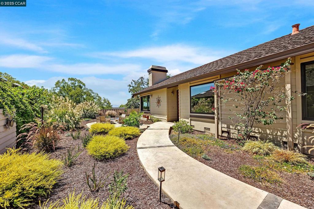 Welcome to a beautifully maintained home in the desirable Verona Village at The Villages Golf & Country Club — San Jose’s premier 55+ active adult community. This spacious 3-bedroom, 2-bath home offers approximately 1,954 square feet of comfortable, light-filled living space. The inviting living room features soaring vaulted ceilings and expansive windows that flood the home with natural light, creating a warm and welcoming atmosphere throughout. The bright, open floor plan flows seamlessly, perfect for both everyday living and entertaining. The generously sized primary bedroom is a true retreat, offering ample space for a sitting area, abundant natural light, and an en suite bathroom for added privacy and comfort. Two additional bedrooms are perfect for guests or home office. Step outside to a beautifully landscaped backyard with multiple patios and stunning views — the perfect backdrop for relaxing or hosting guests. The Villages offers an exceptional lifestyle with an 18-hole championship golf course, tennis and pickleball courts, fitness center, swimming pools, walking trails, organized clubs, events, and more. Live the resort-style life you deserve in this vibrant, gated community!