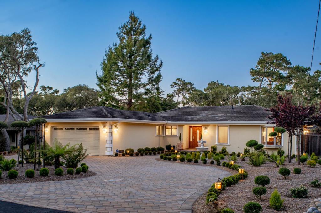 This immaculate single-story residence captures the refined charm & effortless luxury of the Pebble Beach lifestyle. Rich cherry wood flooring & custom cabinetry infuse warmth & sophistication into the open-concept kitchen, dining, & living areas. Offering 3 bedrooms, 2 baths, the home seamlessly integrates indoor-outdoor living with impeccable taste. Every detail has been meticulously curated, showcasing high-end finishes & premium materials throughout. Indulge in Grohe fixtures, travertine marble baths, plantation shutters, crown molding, & an indoor speaker system. Outdoors, a private putting green & low-maintenance stone pavers enhance the homes polished design. A charming custom built Petit-Maison serves as a versatile space, ideal for an artist's studio, or extra storage. Convenient circular drive. Modern comforts include a new TRANE HVAC system with HEPA filtration, a new water heater, Bosch appliances, an in-house fire suppression system, a generator and a spacious pantry with ample storage. For safety, all trees have been removed and the property is fire-hardened. Nestled in a tranquil neighborhood with close proximity to MPCC, Spanish Bay, hiking trails, and the breathtaking Pacific Ocean, this exquisite retreat offers the perfect blend of elegance and coastal serenity.