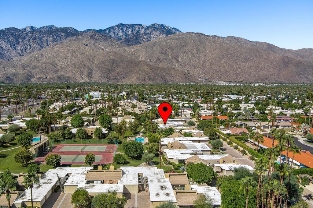 This Hugh Kaptur designed condo is a true 3 bedroom 2 bath with an attached 2 car garage. Designed around a large interior patio this unique concept allows for in-home outside entertaining with complete privacy! Situated in one of the most desirable areas of the complex, this condo exudes a welcoming neighborhood vibe! Inside you will find an open floor plan with high vaulted ceilings and walls of glass allowing the soft flow of light throughout your main living areas. Updated kitchen with a large island, high end appliances and tons of cabinet space. A neutral style tile is continuous throughout the entire home that engenders an expansive flow from room to room. The spacious Primary Suite with room for a cozy sitting area with direct access to your outdoor patio. Primary bathroom has a double vanity and walk-in shower. Two guest bedrooms are on the opposite side of the home that share a central bathroom. There is a 2nd large patio that is perfect for morning coffee or basking in the desert sun. Saddlerock Gardens is a boutique complex of 43 patio homes with 2 pool/spas and 2 tennis courts. Low HOA that covers building, grounds and cable tv. Worryfree style living that is walking distance to restaurants, shopping and coffee houses.