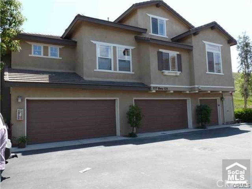 Beautifully Remodeled home with all new Bathrooms, Floors and Paint. End unit townhome with the most private location in the complex. With only 1 neighbor, your own separate entrance, and a large grassy area on the side of home. This home feels like a Single Family Home. 3 Bedrooms, 2.5 Baths with 2 car attached garage. New Downstairs upgraded tile and baseboards. Corian counters and recessed lighting/ceiling fans in all bedrooms and family room are just a few of the special features included. Walking distance to pools, trails and shopping
