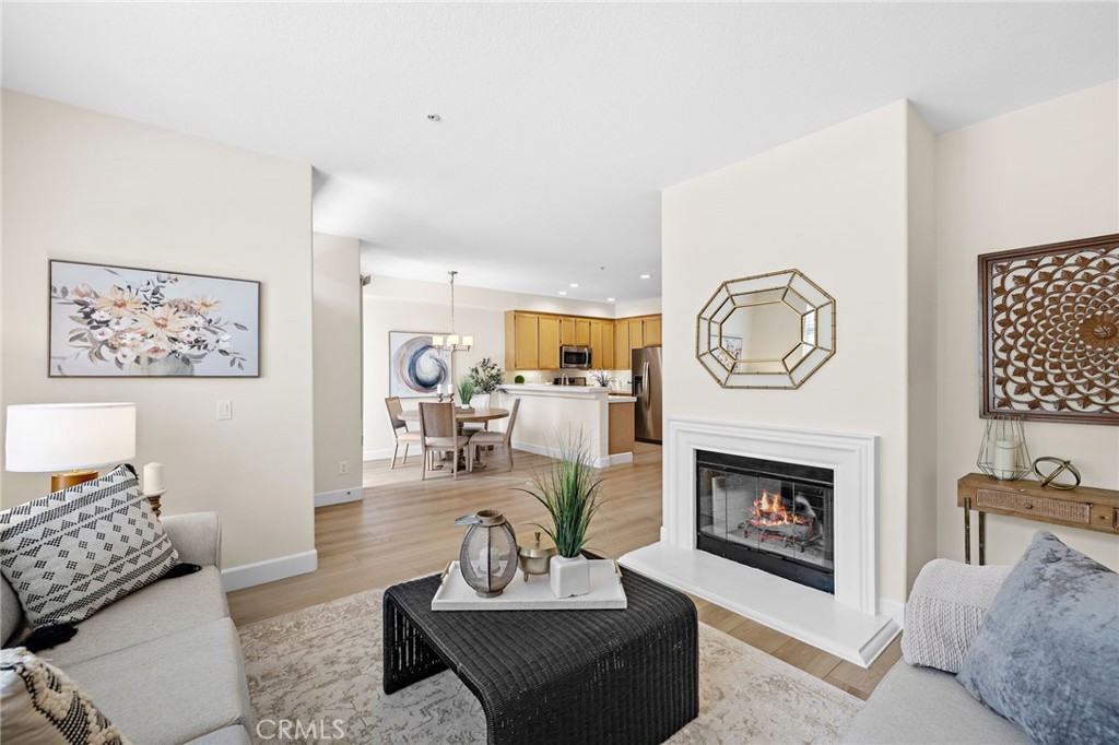 Welcome to 44 Tierra Seguro, a beautifully updated condo located in the highly sought-after Tierra Montanosa community of Rancho Santa Margarita. This light-filled 2-bedroom, 2.5-bath home features a desirable floor plan with dual primary suites and a spacious, open-concept living area ideal for modern living. Recent upgrades include fresh interior paint and new luxury vinyl plank flooring with modern baseboards throughout. The bright kitchen offers ample counter space, a breakfast bar, and flows seamlessly into the dining and living areas—complete with a cozy fireplace and direct access to a private, gated front patio perfect for relaxing or entertaining. The main level also features a newly remodeled powder room for added convenience and a large laundry room with ample pantry storage. Upstairs, both bedrooms include en-suite bathrooms and generous closet space. Additional highlights include an attached, direct entry two-car garage, a full repipe completed within the past year, and newer HVAC and water heater systems. Residents of Tierra Montanosa enjoy access to a resort-style pool and spa, along with all the amenities of the city of Rancho Santa Margarita—including the lake, beach club, tennis courts, parks, hiking trails, and award-winning Melinda Heights Elementary School. With easy access to toll roads, shopping, and dining, this turnkey home offers the perfect blend of comfort, convenience, and community.