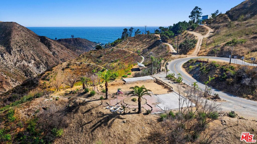 Amazing and rare opportunity to acquire this approximately 14 acre ocean view burn out with a 5 Bed/5 Bath 4,117 sqft original structure and the potential to take advantage of an additional 10% square footage with reconstruction and possible ADU. Nestled up in the Santa Monica Mountains and just five minutes from PCH, feel away from it all as you revel in the ultra privacy and quiet, while still being minutes to beaches and central Malibu shopping, dining, and more. A special oasis, this incredible gem boasts breathtaking 360 degree canyon and ocean views and ease of access to countless beloved hiking and biking trails.