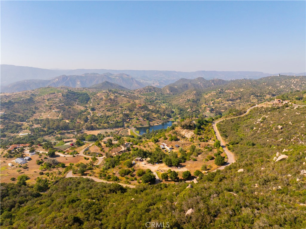 Welcome to De Luz Ranch — a scenic and versatile 68.04-acre landholding located in the rolling hills of De Luz, a premier agricultural enclave tucked within the Santa Rosa Plateau. Available for the first time in over 20 years, this rare offering presents a compelling opportunity for agricultural operators, estate developers, and land investors seeking scale, flexibility, and long-term upside.
Strategically positioned just 15 minutes west of I-15, the property offers a rare balance of rural seclusion and convenient access to nearby markets including Temecula, San Diego, and Orange County. With panoramic views, gently sloping topography, and multiple buildable pads, the site is ideally suited for custom homes, boutique farming, equestrian use, or vineyard and winery development. Zoned A-70 (Limited Agriculture) and designated RL-20 under the General Plan, the property supports residential and agricultural uses by right and offers the potential to unlock 2–4 legal parcels via Certificate of Compliance—no subdivision map required.
This asset also lends itself to integration into larger agricultural ventures, farm co-ops, or long-term land banking strategies. Utilities are nearby, and the region is known for reliable well water and consistent yields across avocado, citrus, grape, and olive crops.
With its attractive price of $636,500 ($9,354 per acre), gated access, and proximity to established rural estates and active farms, De Luz Ranch is well positioned for long-term appreciation, income generation, or personal estate use.
Offered via private sale, De Luz Ranch represents a rare opportunity to acquire a legacy parcel with income-producing potential in one of Southern California’s most enduring and strategic agricultural corridors along the Avocado Belt.
Offering Memorandum available upon request.