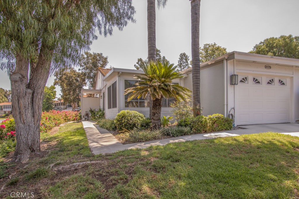 Welcome to 3179-A Alta Vista – a lovely highly-upgraded expanded one-bedroom, one-bath, single-level end-unit LA PRINCESSA residence in the Laguna Woods senior community. There is an open patio off the cozy living room that provides great outdoor space for entertaining, dining or relaxing. The kitchen has a breakfast bar that easily accommodates seating for three. The bathroom has a tub/shower combo with grab bars and a convenient accessory shelf. The original patio just off the dining area has been fully enclosed and converted to living space (approximately 120 sq. ft. that is not included in the published square footage of 830 sq. ft.) This multi-purpose bonus room could serve as a home office, exercise room, arts and crafts studio or library. Upgrades include attractive laminate flooring, energy-efficient dual-pane windows and sliders, recessed lighting, crown molding, smooth ceilings and skylights in the kitchen and bathroom. This property has central heat and air. The attached one-car garage has epoxy flooring, lots of cabinet storage, washer-dryer hookups and convenient direct access into the residence via the kitchen service door. The driveway can accommodate one additional vehicle. This residence is conveniently located near Gate 7 with easy access to shopping and restaurants. Do not miss this terrific property!