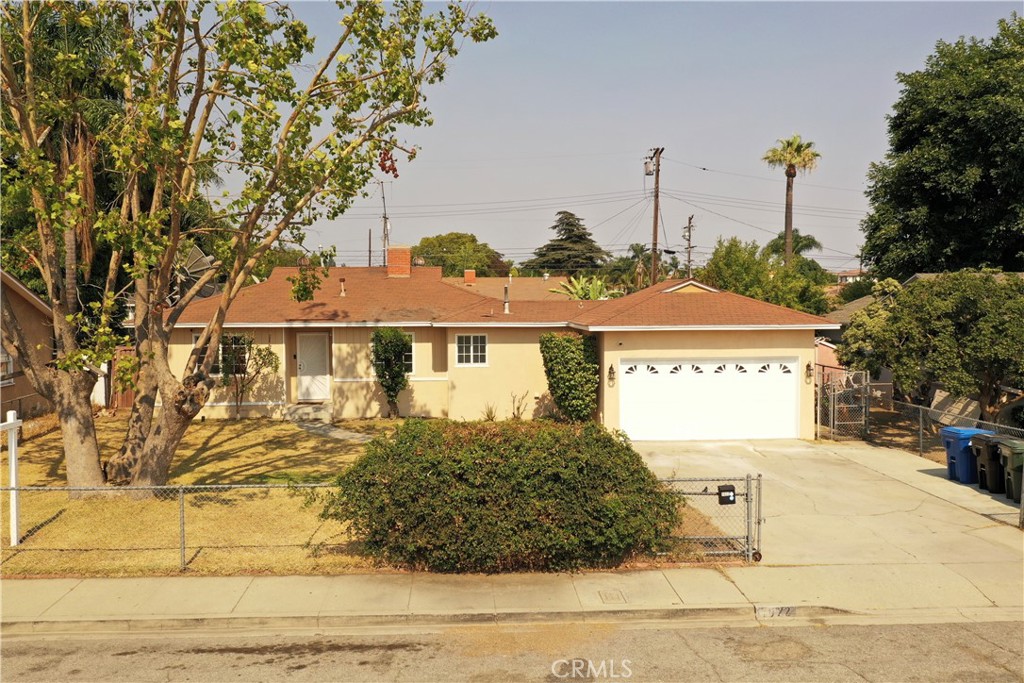 Welcome to this charming mid-century home nestled in a cul-de-sac next to Kiwanis Park. As you step through the front lot, you'll be greeted by a specious front yard with a large tree perfect for shade. Once inside of the home, there's the private master bedroom on the right, making it private away from the other two bedrooms. The master bedroom does have a half bathroom and a door to the laundry room. There's enough space to extend the bathroom to add a shower if desired. As you continue walking from the front door, to the left there's a hallway with two bedrooms and an upgraded bathroom in the middle, separating the two rooms for privacy. The living room has a cozy fireplace and is opened with the dining room, both get a great amount of natural light. The kitchen is a good size, offers direct access to the laundry room and has a side door to the backyard. Once you're in the backyard, there is a bonus room (about 184 sqft) attached to the living room, matured fruit trees and hardscape. Some of the updates include: matching fans in all the bedrooms, interior and exterior paint, light fixtures, dual-pane windows, back splash tile in kitchen, new garage door opener, kitchen faucet remodeled hall bathroom. Conveniently located, this property is walking distance to Kiwanis Park, provides easy access to shopping centers, schools, and major freeways.