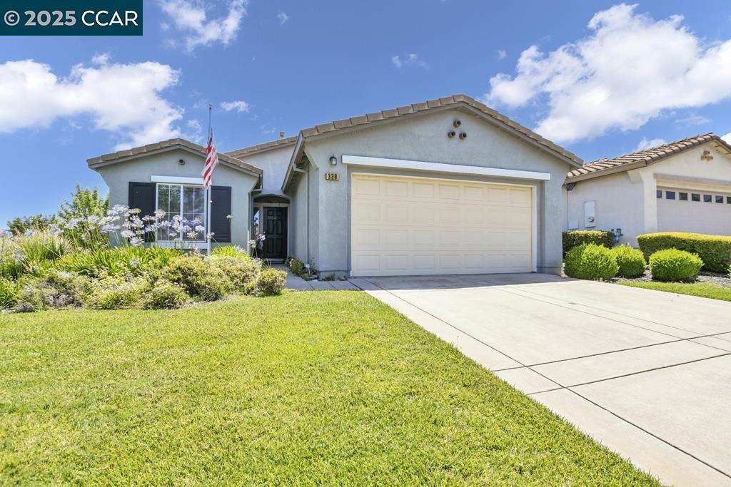 Welcome to this charming single-family home on a desirable corner lot in a 55+ community! This 2-bedroom, 2-bathroom home features an open and bright floor plan. Fresh interior paint and beautifully painted cabinets in the kitchen and both bathrooms. Enjoy cooking with a gas range and relaxing or entertaining on the private back patio. The home offers a spacious front and backyard—perfect for gardening or outdoor enjoyment. A 2-car garage provides ample parking and storage. Located in a peaceful, well-maintained neighborhood designed for active adult living, this home is move-in ready and waiting for you!