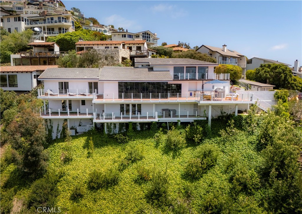 Emerald Bay | Short Term rental | Two week minimum. Available June 13th through August 4, 2025.
Welcome to 343 Emerald Bay, nestled in one of the most prestigious private beach communities in Southern California.
This contemporary home is beautifully designed and fully furnished to provide the ultimate memorable getaway.
The updated open floor plan has a large living area with vaulted ceilings, and a well-appointed chef's kitchen designed to accommodate both culinary enthusiasts and everyday cooks. With four inviting bedrooms and an additional fifth room ideal for either a home office or personal gym, and a downstairs den, this home offers versatility and comfort for modern living. The upstairs primary suite opens to its own deck overlooking Catalina and beautiful sunsets.
Relax on the spacious private deck, perfect for hosting gatherings with an outdoor kitchen, while soaking in the panoramic scenery.
Located in a coveted cul-de-sac on Emerald Canyon with commanding views of both the canyon and Pacific ocean. A short walk to the beach and all of the communities amenities, your lease comes with a golf cart.
As residents of Emerald Bay, take advantage of exclusive access to a private 1/2 mile sandy beach, along with amenities such as tennis courts, beach volleyball, a swim center, beautiful parks more. Community events , camps and vigilant security further enhance the neighborhood's appeal. Enjoy the relaxed coastal lifestyle of 343 Emerald Bay.
