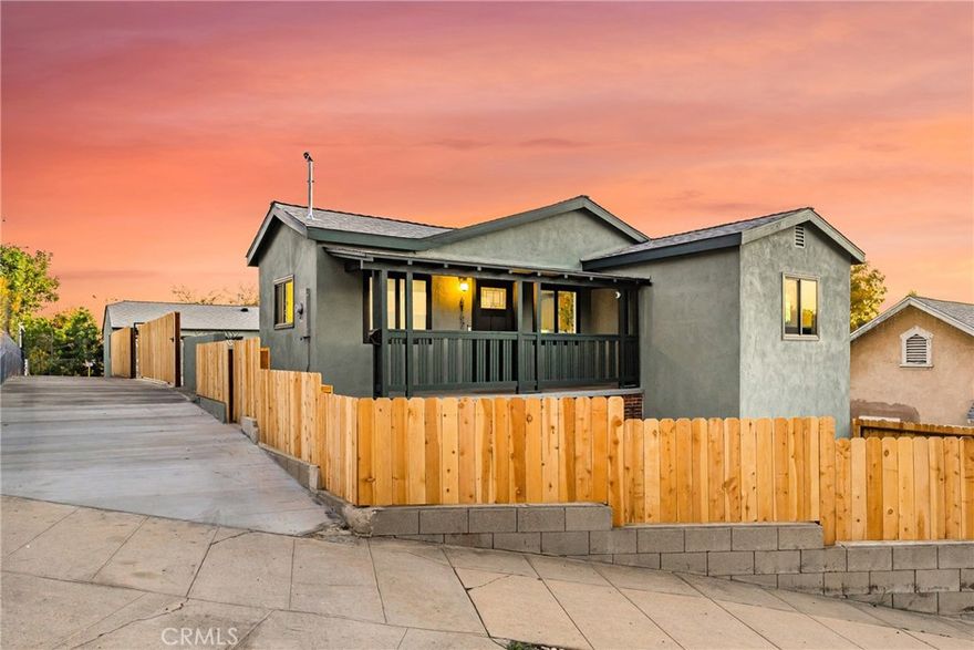 Perched on a quiet hillside street, The Painted Palm House at 6162 Annan Way delivers the rare trifecta: architectural charm, thoughtful renovation, and an ADU- all wrapped in a design-forward aesthetic that feels straight out of a magazine.

The 2 bed / 1 bath main residence is filled with natural light and features warm Oak-style flooring, smooth skim-coated walls, and a modern neutral palette. The reimagined kitchen showcases two-tone cabinetry, open shelving, designer brass hardware, and Café appliances, flowing easily into the dining and living areas. Both bedrooms are bright and serene, while the spa-worthy bath offers a skylight, artisan tile, fluted wood vanity, and brushed brass fixtures.

Outside, the home shines with new exterior paint, fresh landscaping, updated hardscape, and a newly paved driveway, creating a backyard perfect for morning coffee and golden-hour gatherings.

The detached 1-bed/1-bath ADU mirrors the same elevated finishes, making it ideal for guests, rental income, or multi-generational living. A 2-car garage, two additional parking pads, and a separate bonus room offer rare flexibility for a studio, gym, or office.

Its signature statement- the custom hand-painted palm mural- gives the property its name and unmistakable SoCal identity, delivering curb appeal that truly stops traffic.

Minutes from York Blvd cafés, boutiques, and nature trails, The Painted Palm House is a lifestyle upgrade with built-in versatility- turnkey, design-forward, and move-in ready.