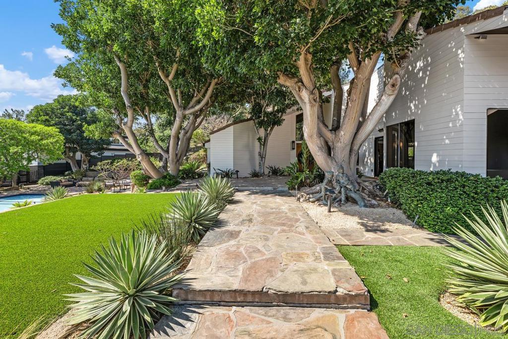 Location is everything! This stunning 5-bedroom, 5.5-bath home sits on nearly two acres at the end of a peaceful cul-de-sac in the sought after Hidden Mesa Estates. With 3,990 sq. ft. of thoughtfully designed living space, this home blends grandeur, comfort, and endless potential. Step inside to soaring 18-foot ceilings and expansive windows that fill every room with warmth and natural light, elevating each space and creating an open and elegant atmosphere. Perfectly designed for both everyday living and entertaining, the home features multiple living areas, generously sized bedrooms with en-suite bathrooms, and custom features throughout to include double lofts with a skybridge! The home is also equipped with a second kitchen and laundry area, making it ideal for multi-generational living or extended stays. Step outside to nearly two acres of your own private paradise featuring an oversized sparkling pool, peaceful walking trails, and two charming outbuildings ideal for a playhouse, art studio, stable or storage. Move-in ready yet brimming with opportunity, this home invites you to make it your own. Whether you’re dreaming of a custom kitchen, a serene spa-inspired retreat, or bold designer finishes, there’s space here to bring your vision to life. If you’re seeking space, privacy, and a home with incredible beauty, this is the one. Homes like this are rare, so don’t miss your chance! Make sure to watch the video!
