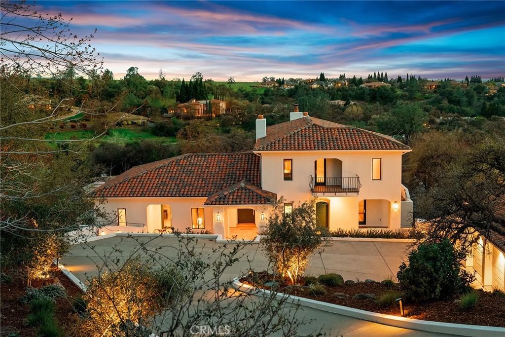 Breathtaking custom home in Canyon Oaks Country Club with unparalleled views! Perched atop a hill, this incredible home offers sweeping views of the golf course, the Coastal Range, and twinkling city lights. Thoughtfully designed for privacy and serenity, the property is surrounded by stunning landscapes, including fruitless olive trees from Sonoma and majestic blue oaks. Step inside through the grand foyer and immediately feel the warmth of this inviting home, where exquisite craftsmanship and designer touches abound. Flooded with natural light, the interior boasts lime-washed, wood-beamed ceilings, elegant arched doorways, and custom chandeliers from South Africa. The living room is the heart of the home, featuring a gas fireplace and a stunning cedarwood Moroccan media cabinet. Designed for both entertaining and everyday comfort, the dining room and breakfast room open to patios, creating the perfect setting for morning coffee or sunset gatherings with breathtaking views. The kitchen is fully equipped with all-new high-end appliances, including a 48” Sub-Zero refrigerator, Wolf double oven, gas cooktop, and microwave. Downstairs, two spacious guest rooms and a guest bathroom with a walk-in shower offer comfort and privacy, along with a private entrance—perfect for hosting guests. Upstairs you will find the primary suite. This is a true retreat, offering a private terrace with panoramic views, a cozy fireplace, a jetted soaking tub, walk-in shower, an expansive walk-through closet, and a library room for quiet relaxation. Outside, the beauty continues with a Bob Hill-designed pool featuring Moroccan tile, a covered patio with a fireplace, designed for year-round enjoyment and entertaining and meticulously planned landscaping surrounding the property. This home is truly one of a kind, blending luxury, comfort, and stunning design. A dream for entertaining, every detail has been thoughtfully curated to create an exceptional living experience. There are too many incredible features to list—you must see this home in person to fully appreciate its beauty and craftsmanship.