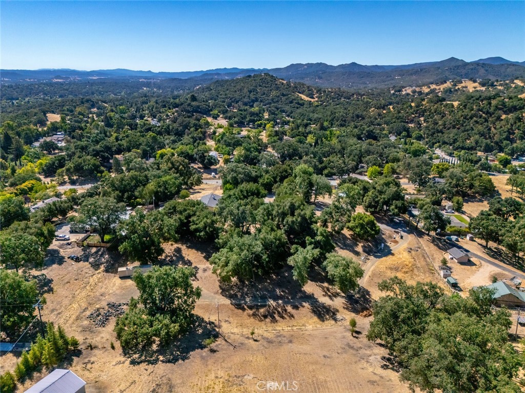 Don’t miss this well-priced 2.53-acre parcel offering a beautiful and private setting with natural charm. Centrally located minutes from schools and town, this gently rolling lot is dotted with mature oak trees, creating a peaceful and picturesque environment. The property includes an existing well, is mostly perimeter fenced with an orchard, and has power nearby—making it an excellent opportunity to invest now and build your dream home later. With its desirable location and usable terrain, this land offers the ideal combination of rural tranquility and easy access to everyday amenities.
