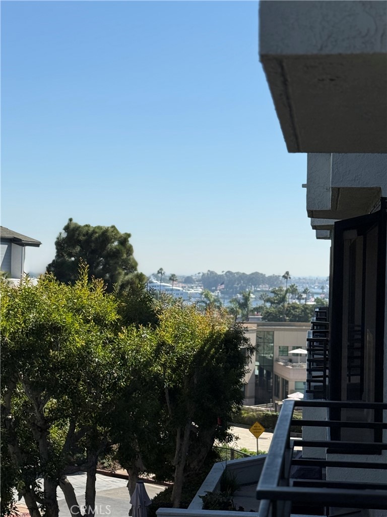 Don’t miss the opportunity to lease in the beautifully maintained, gated community of Villa Balboa, ideally located within walking distance to the beach, Balboa Peninsula, a large city park, and Hoag Hospital.
This second level 1,201 sq. ft. condominium is filled with natural light, featuring a skylight and expansive sliding glass doors and plantation shutters throughout. Enjoy calming ocean breezes and bay views from the balcony, perfect for indoor-outdoor living and entertaining. The open-concept living room includes a cozy gas fireplace and direct access to the large balcony, offering a peaceful place to relax or host guests. The home includes a primary suite with its own full bathroom and a secondary room with it's own full bathroom. Additional features include a garage parking space, cabinet storage, and room for bicycles.
Within the gated community, residents have access to exceptional amenities including two swimming pools, two large hot tubs, tennis and pickleball courts, a fitness center, and a spacious clubhouse with a full kitchen available for private gatherings. There's also a welcoming community center with a library, computer workspace, and retreat areas, plus beautifully landscaped grounds with BBQ areas and walking paths that lead to a scenic bluff just outside the gates. This is a rare opportunity to enjoy upscale coastal living in one of Newport Beach’s most desirable communities.