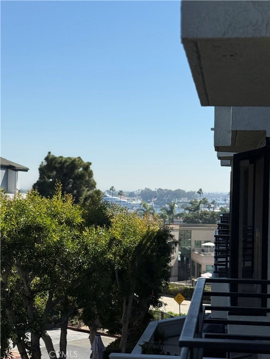 Don’t miss the opportunity to lease in the beautifully maintained, gated community of Villa Balboa, ideally located within walking distance to the beach, Balboa Peninsula, a large city park, and Hoag Hospital.
This second level 1,201 sq. ft. condominium is filled with natural light, featuring a skylight and expansive sliding glass doors and plantation shutters throughout. Enjoy calming ocean breezes and bay views from the balcony, perfect for indoor-outdoor living and entertaining. The open-concept living room includes a cozy gas fireplace and direct access to the large balcony, offering a peaceful place to relax or host guests. The home includes a primary suite with its own full bathroom and a secondary room with it's own full bathroom. Additional features include a garage parking space, cabinet storage, and room for bicycles.
Within the gated community, residents have access to exceptional amenities including two swimming pools, two large hot tubs, tennis and pickleball courts, a fitness center, and a spacious clubhouse with a full kitchen available for private gatherings. There's also a welcoming community center with a library, computer workspace, and retreat areas, plus beautifully landscaped grounds with BBQ areas and walking paths that lead to a scenic bluff just outside the gates. This is a rare opportunity to enjoy upscale coastal living in one of Newport Beach’s most desirable communities.
