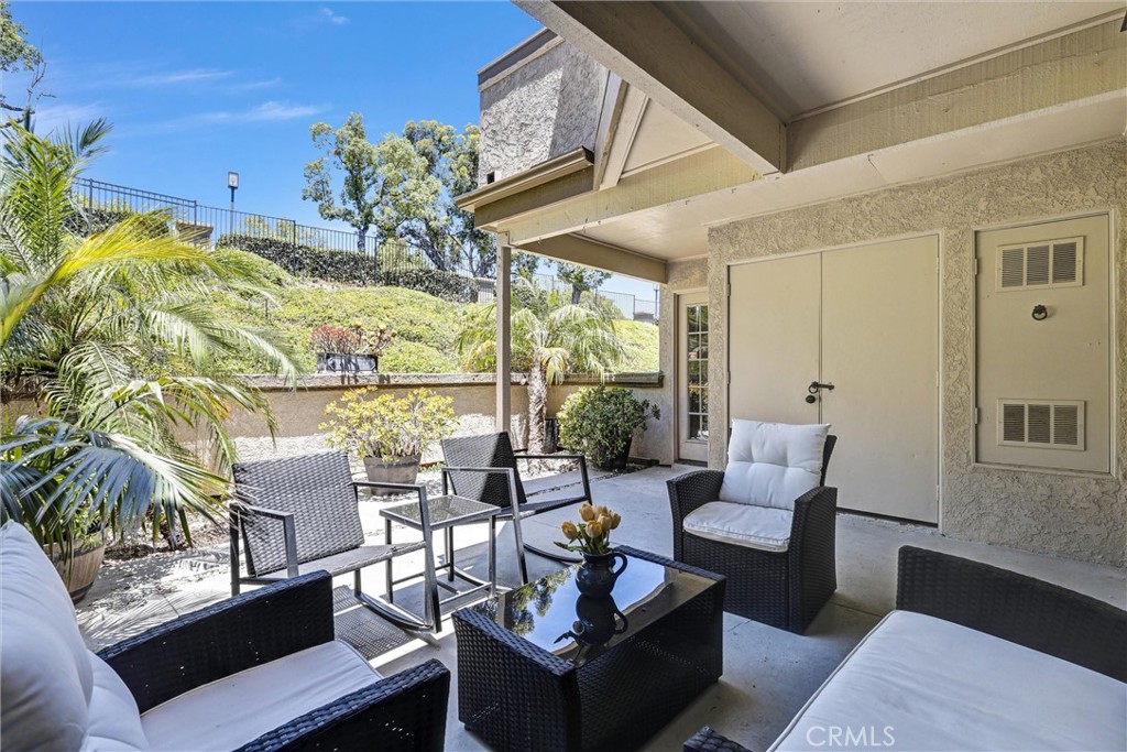Welcome to this charming 2-bedroom, 1-bath ground-level condo in the serene Villa Mira community. With nearly 800 sq ft of thoughtfully designed living space, this home offers an open-concept layout, central A/C and heat, in-unit laundry, and a private patio—perfect for relaxing or entertaining. The patio offers total privacy from away from other units. The patio can be accessed from the main living area and also from the secondary bedroom. Enjoy access to community amenities including a pool and spa, all just minutes from shopping, dining, parks, and the beach. Ideally located near Cabot Road and Paseo del Colinas, with convenient freeway access.