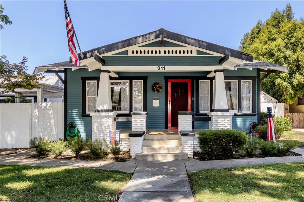 Beautifully updated Downtown Fullerton Historic Craftsman home offering 3 bedrooms and 1,270 square feet on an expansive 7,700 square foot lot built in 1921. Classic details such as the welcoming front porch and timeless crown molding are complemented by modern improvements throughout. The interior has been thoughtfully upgraded, including new decorator paint, beautiful new plank flooring and new carpet, recessed lighting, and new custom closets. The kitchen features a new KitchenAid dishwasher, 5-burner gas stove, and a new low-profile microwave. The main bathroom has been stylishly remodeled and boasts a cast iron clawfoot tub. The second bath has also been refreshed with a new vanity, lighting, mirror, and toilet. Additional enhancements include new cabinetry in the laundry room and updated landscaping in the front yard. The property offers a detached one-car garage with additional generous storage and workshop space, plus lots of additional private gated parking and RV parking. The huge backyard space has wide side yards, covered patios, and a big grassy area. With its oversized lot, this home presents an excellent opportunity for a future ADU addition. No HOA and a low property tax rate make this home affordable. Great location near downtown Fullerton shops and restaurants.