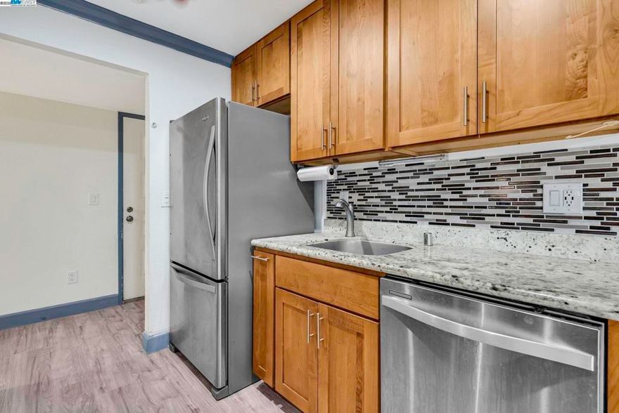 OPEN HOUSE 10/18 and 10/19 1:00 PM - 4:00 PM. FREE PUMPKIN FOR EACH VISITING GROUP! Welcome to a place where comfort meets charm in the heart of Newark. Every inch of this single level condo has been refreshed, from the floors beneath your feet to the energy-efficient windows that keep the seasons gentle indoors. Thoughtful details in this remodel help make everyday living a little brighter. Flow effortlessly from the modern kitchen to the living area with included mounted TV's. A fireplace helps create the perfect space for relaxing evenings and a private patio welcomes you to fresh air and morning coffee. Enjoy the ease of in-unit laundry and two parking spaces, plus a community that feels like a retreat - with multiple pools, tennis courts, and a fitness center right at your doorstep. Just minutes from NewPark Mall, local dining, Dumbarton Bridge, and the picturesque trails of Don Edwards San Francisco Bay Refuge, this home offers both connection and calm. A beautiful beginning for anyone ready to fall in love with home ownership for the first time or downsize with accessibility and convenience in mind.