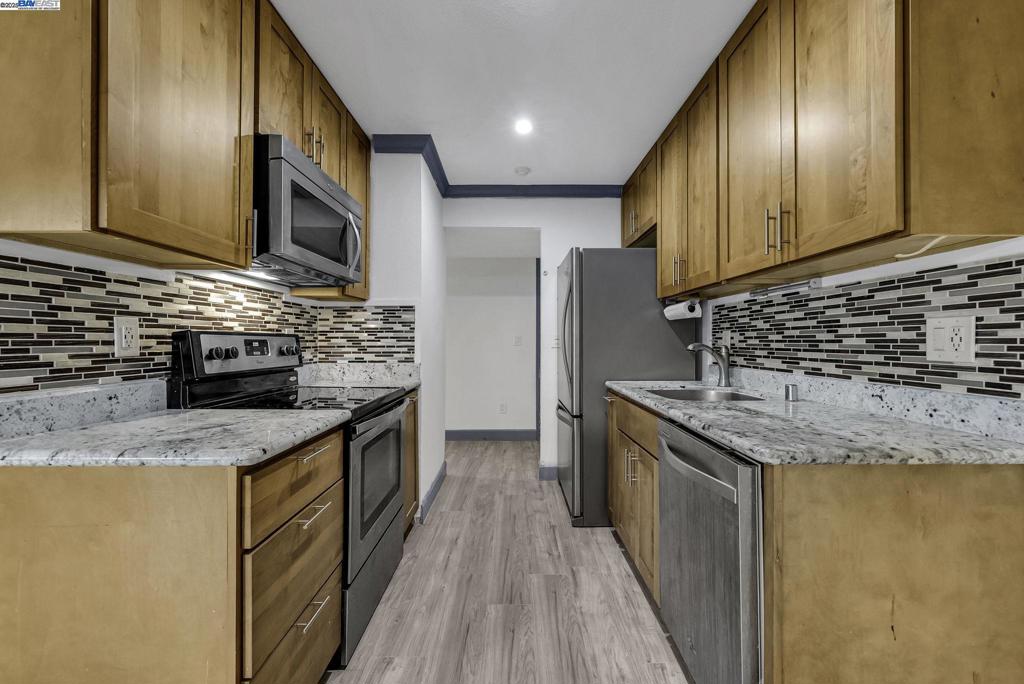 This condo has been upgraded from the floors to the ceiling. Completely remolded and comes fully stocked with fridge, two mounted TVs, a fireplace and washer and dryer, microwave, dishwasher, garbage disposal, and many more amenities located in the property. The bathroom has been remolded with a larger shower stall a bath and a fitted shower 2 piece seamless shower door. R&M Quality Windows and doors installed in the entire condo. Two parking spaces and a video door camera installed. Simonton Day/Light Max series on all six downstairs windows and the 8 ft. sliding glass door. All new flooring throughout the unit giving it an extraordinary contemporary look and feel all the way to the backyard. Good size backyard All appliances including microwave, washer, dryer, fridge, light fixtures were purchased by the owner. 360 tour here https://tinyurl.com/newarkcahomesale
