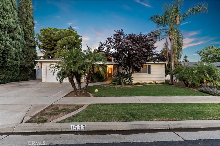 Discover your dream home in the heart of Clovis, perfectly situated near a vibrant shopping center! This stunning residence boasts 3 bedrooms and 2 modern baths, providing ample room for your family to thrive. Enjoy the two inviting living spaces that offer versatility for relaxation or entertainment. Step into  a beautifully designed kitchen featuring updated cabinets with pull-outs, gorgeous granite countertops, and sleek stainless steel appliances. The master bedroom is a true retreat with its generous walk-in closets, giving you plenty of space to organize and unwind. But wait, the real highlight awaits outside! The expansive backyard is an entertainer's paradise, complete with a covered patio, a sparkling pool for those warm summer days, and a lush green area perfect for gatherings or simply enjoying the sunshine. Don't miss this incredible opportunity to own a piece of paradise in Clovis. Schedule your private showing today and take the first step towards making this beautiful house your forever home!