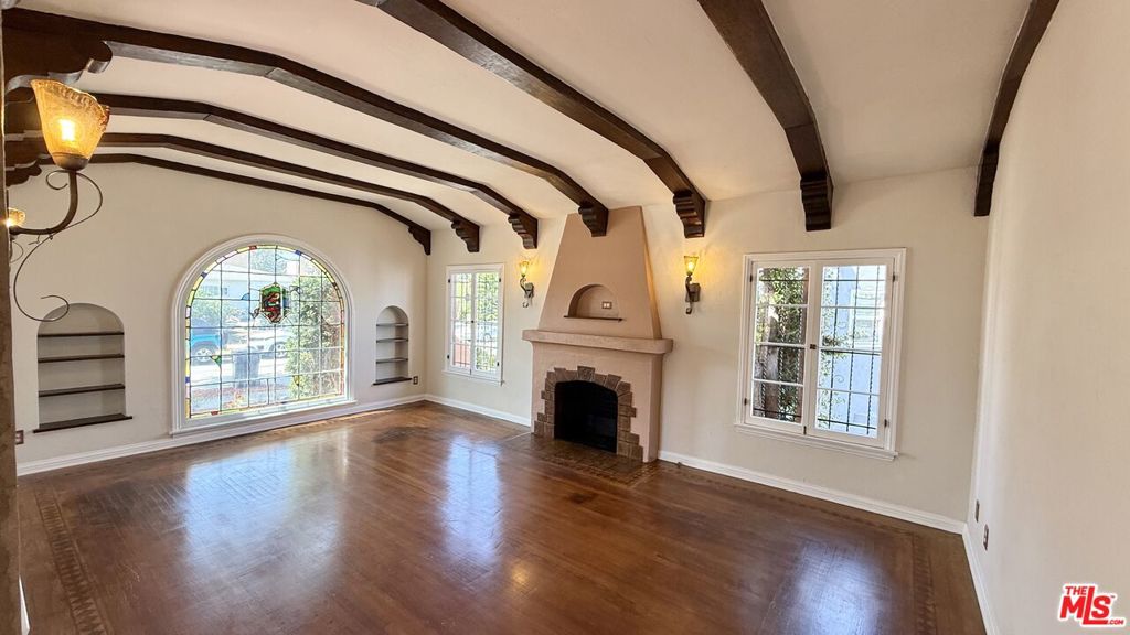 Step into the charm of this beautifully preserved Spanish-style 3 bed/2 bath home in the heart of historic Leimert Park. From the moment you enter, you're greeted by a welcoming foyer that sets the tone for the character and warmth throughout. This home features original character hardwood floors, a stunning copper sink, and stained glass windows that bring in colorful light and timeless elegance. The thoughtful layout includes a formal dining room, a cozy breakfast room, and spacious living areas perfect for both entertaining and everyday comfort. Additional highlights include a two-car garage, a generous yard for outdoor enjoyment, and architectural details that make this home one of a kind. Enjoy a neighborhood rich in culture, community, and convenience. Just minutes from local cafes, art galleries and Metro access. Short proximity to Culver City, Downtown LA, and the Westside. Don't miss the opportunity to lease a piece of Los Angeles history in one of the city's most treasured neighborhoods.