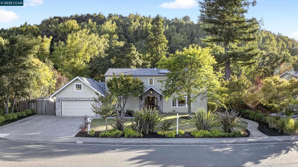 Open 8/16 & 8/17 1 to 4pm. This elegantly remodeled home sits on one of the area’s most sought-after streets, blending timeless charm with sophisticated, high-end finishes throughout. The private, fully landscaped creekside lot offers a serene setting with an outdoor kitchen, lush lawn, and a spacious deck—perfect for entertaining or quiet relaxation. MAIN LEVEL: Sun-filled living room with a striking fireplace; inviting reading room/library or office; open dining and kitchen area with professional-grade appliances, custom cabinetry, and a stunning Terrazzo island countertop; large laundry room with abundant storage; plus a bedroom and full bathroom. Rare deeded full golf membership to Moraga Country Club - No transfer fee - $898/month UPPER LEVEL: Luxurious primary suite with a private balcony and generous closets; spa-inspired primary bathroom; two additional spacious bedrooms; and a full bathroom. GUEST SUITE: Complete with a bedroom, cozy study nook, and full bathroom—ideal for visitors or extended stays. GREAT LOCATION: Safe, flat, wide streets that are bikeable and walkable to excellent K-8 schools. Owned Solar system with Electric car charging. Rare deeded full access to Moraga Country Club - no transfer fee. $898/month.