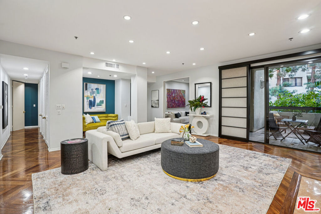 This grand and spacious 2-bedroom, 3-bath condo in Century City offers a bright, open layout designed for modern living. The kitchen and enclosed dining area feature two pass-through windows that connect to the living room and patio, creating an easy flow for entertaining. The primary suite includes a fireplace, a full bathroom with dual sinks and a separate shower, and a large walk-in closet with added storage. The second bedroom also offers a walk-in closet, a full bath, and access to a shared balcony with the primary suite. A separate laundry room with extra storage adds everyday convenience, and the unit includes three assigned parking spaces. Residents enjoy a full suite of amenities, including multiple pools throughout the community plus this building's own private pool and jacuzzi. Additional features include a gym, sauna with separate men's and women's facilities, a recreation room, and a barbecue area. The community also offers tennis, pickleball, and basketball courts, all within a secure, gated environment. Situated in the heart of Century City, this home is moments from Westfield Century City, Beverly Hills, and many of LA's premier dining, shopping, and entertainment destinations. With quick access to the 405 and 10 freeways, residents are within easy access to Downtown LA, Santa Monica, and the Westside combining luxury, convenience, and the best of city living.