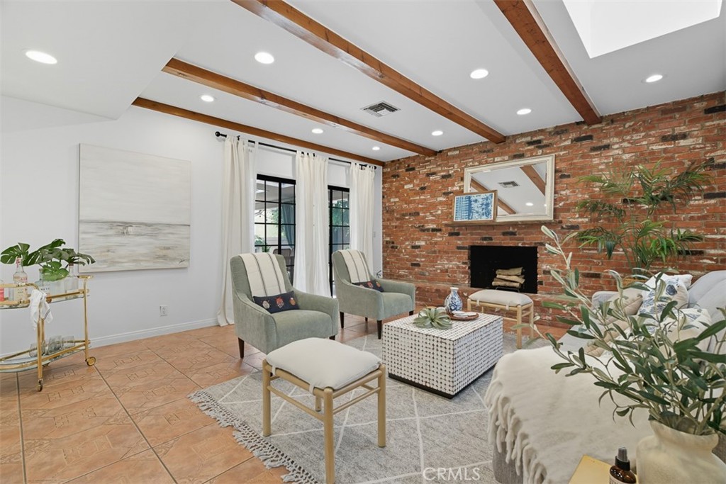 Sunlit Burbank Charmer with Mountain Views and Outdoor Living
Nestled north of Glenoaks in one of Burbank’s most sought-after pockets, this freshly updated 3-bedroom, 1.5-bath home blends classic warmth with modern comfort. With mountain views, a private fenced yard, and inviting indoor-outdoor flow, this property offers the kind of everyday ease that’s getting harder to find.
Step inside to a spacious, sun-drenched living room featuring rich hardwood floors, an oversized brick fireplace, and direct access to a covered rear patio—perfect for seamless entertaining or relaxed evenings at home. The living and dining areas are open and airy, while the bedrooms feel cozy and private. The primary bedroom includes its own en suite half bath, offering extra convenience and privacy.
Throughout the home, you'll find thoughtful upgrades including fresh interior paint, central air conditioning, and hardwood flooring in the bedrooms and living spaces. The fenced front yard adds charm and privacy, and the covered rear patio is ideal for lounging, outdoor meals, or enjoying the views. Situated on a quiet, residential street just minutes from parks, shops, and top-rated Burbank schools, this home delivers both comfort and location.
Whether you're upsizing, rightsizing, or planting roots in the heart of the Valley, this charming Burbank retreat is ready to welcome you.