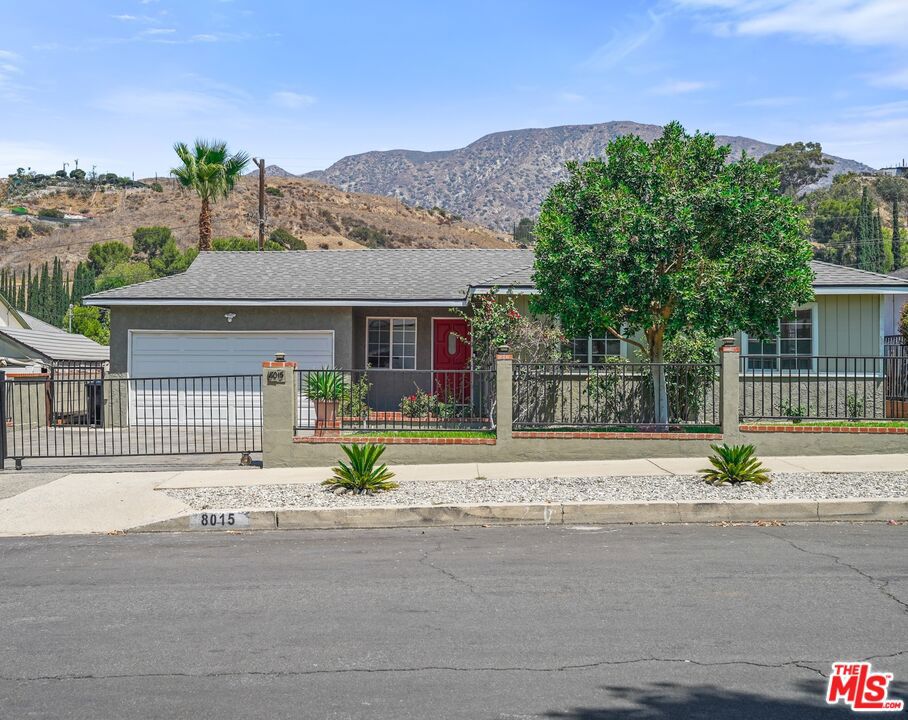 This charming three bedroom, two bath home offers comfort, space, and lots of potential. It sits on a generous lot with beautiful mountain and canyon views, making it a great fit for anyone looking for a move-in ready home with room to grow. Inside, you'll find a cozy fireplace, a functional kitchen with a dishwasher, and in-home laundry. The backyard is spacious and filled with mature fruit trees, raised garden beds, and plenty of room for kids, pets, or entertaining. The lot is flat and usable, with great potential for adding a pool, creating an outdoor living area, or potentially building an ADU. Other highlights include a fenced yard, an attached garage, plenty of driveway parking, and a brand new roof that was installed in July 2025 with permits. Whether you're looking to expand, invest, or just enjoy the California lifestyle, this home is a solid opportunity.