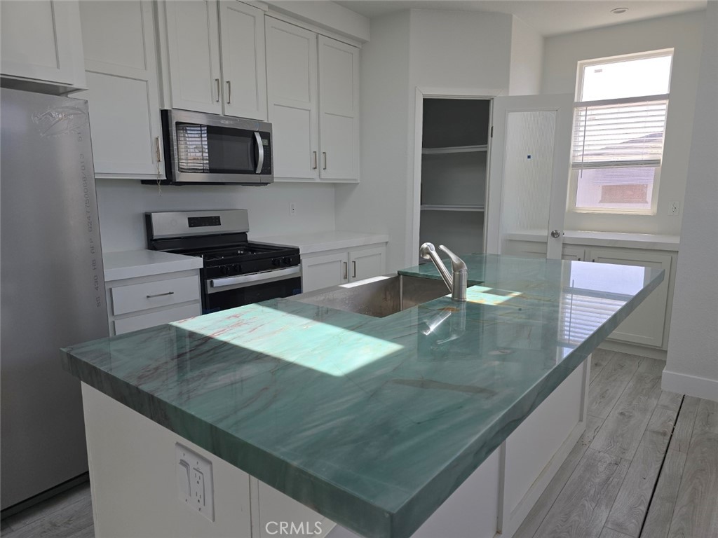 Brand New Architectural manufactured home in great quiet safe gated community. Land Rent ONLY $1350 PER MONTH! Amazing Architectural modern home filled with light and privacy. Chef’s island kitchen with inspiring quartzite emerald and orange natural stone counter. Large walk in pantry, soft closing modern cabinets and drawers, bathed beneath 12 foot skylights. Open Floor Plan. Spacious living room and dining room, both bathed in light. Spacious master bedroom with large walk in closet. 2 additional bedrooms, and optional study which opens into living room, offering perfect den/office space. Luxurious master bathroom suite, with enormous 9 foot stone shower with sitting bench. 10 foot counters featuring his/her sinks, quartz counters, finest materials and endless counter space. Also , private toilet room. Bathroom 2 features amazing 9 foot tall stone shower, quartz counter. Home features great insulation, double fire rated windows. Incredibly energy efficient. Gas and electricity bills UNDER 50 dollars per month. Full utility room. 3 car covered parking. Room for large deck. Gated community, quiet and safe. Nice clubhouse and pool. NO HOA Dues to pay. NO Regular Property Tax to pay.