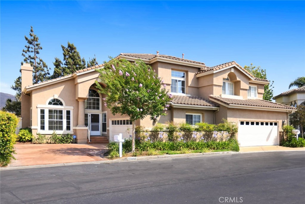 Absolutely stunning Freshly pained 3 bedroom + den view home. The architecture is extraordinary with high ceilings, curved openings and niches. Highly upgraded with beautiful wood look tile flooring downstairs and carpeting and tile upstairs. The kitchen has been remodeled with beautiful wood cabinetry, gorgeous granite counters, stainless steel appliances and a cozy window seat. The living room includes a lovely custom tiled fireplace with mantle. There are high quality plantation shutters on most all windows and all of the baseboards have been replaced. The master bedroom is large with custom organizer walk-in closet, ceiling fan and views of the hills and city lights. The spa like master bath is perfect for relaxation with chevron pattern tile flooring a large shower and separate soaking tub. The master bath has marble 1/2 walls, a marble shower and vanity with marble counter tops under cabinet lighting & dual sinks. Also included in the master bath is another closet with custom organizer. There are two secondary bedrooms upstairs with ceiling fans and one includes a walk-in closet. The family room is adjacent to the kitchen and includes a ceiling fan & access to the lovely back yard. The back yard has saltillo tile,cement pavers and artificial turf on the side yard. There is also a convenient inside laundry. The association amenities are wonderful with 2 pools, 2 spas, tennis court and sport court. Award winning school district and within the new Yorba Linda high school area.