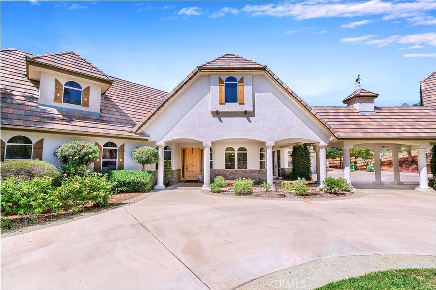 Beautiful custom estate nestled on 4.36 acres in the heart of Temecula Wine Country. Wrought iron gate entry leads to a circular drive with porte-cochere bridging main house with separate guest quarters, full bath and garage areas. This estate boasts 3,330 sq. ft of luxurious living. Main living is on the main floor with the master suite with retreat and fireplace. Jack & Jill bedrooms located at other end of home. An upstairs office or could be a bedroom with balcony. This beautiful home boasts 4 bedroom/3 bath, living room and family room with wood burning fireplace. The kitchen is well appointed with double ovens, lots of beautiful cabinetry, large island, stainless steel appliance, sub zero refrigerator and a walk in pantry. Fantastic outdoor covered living areas w/BBQ island overlooks pool with diving board and spa. Wifi remotely activated spa & pool controls. A separate guest house 750+- sq. ft. sleeps 4 with one bedroom and one bath, walk in closet, living room area with kitchenette. Wonderful covered patios in the front patio with a darling casita that sleeps 2 with 1 bedroom & 1 bath and walk in closet and garage. The horse facilites are fantastic with 6 stall barn with large breezeway, hay room, tack room and wash racks & grooming stalls. Huge working arena with lights approx. 100x200 ft. Large paddocks with covers. Lots of usable land with plenty of turnaround for trailers & RV's. RV pad with electricity, water and dumping station. All fenced and cross fenced with security gates. Centrally located with 1.5 hours to LA, San Diego, Orange County & Palm Springs. Temecula living at it's best!!