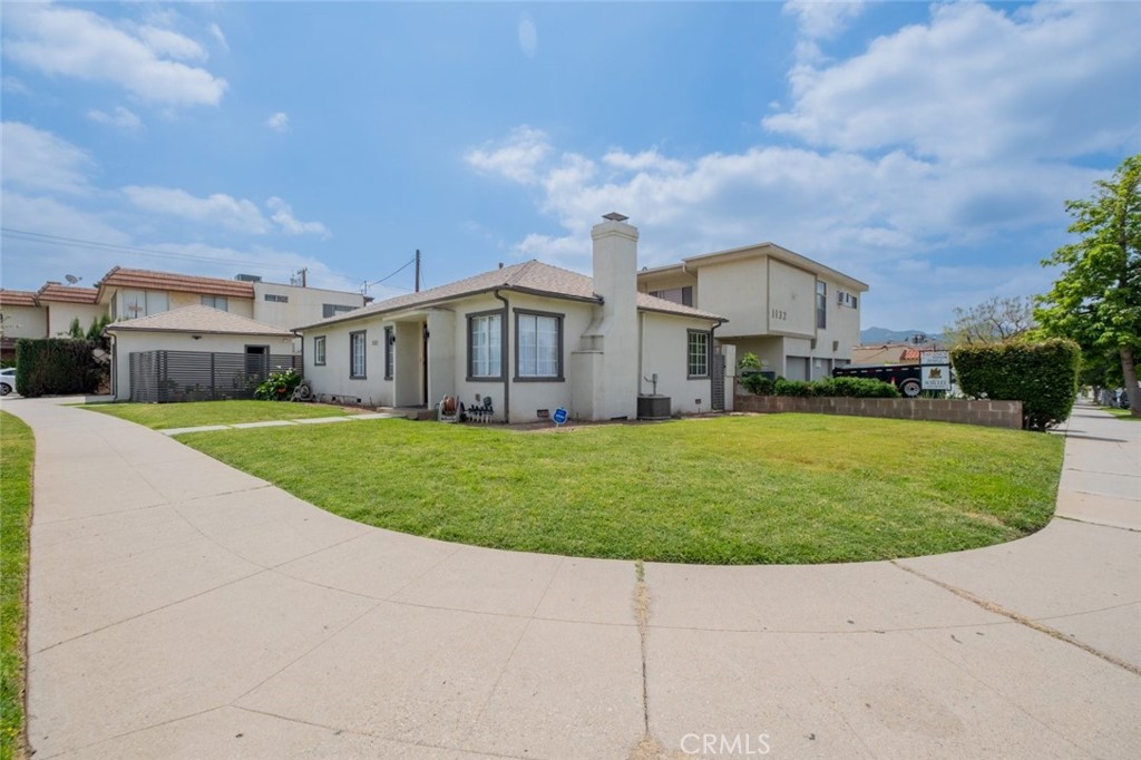 Located in Northwest Glendale above Glenoaks, this inviting 3-bedroom 2-bathroom home offers 1,296 square feet of thoughtfully designed living space. From the moment you arrive, you will appreciate the clean lines and modern aesthetic enhanced by beautiful tile flooring throughout the main areas. The home is filled with both natural and recessed lighting, creating a warm and welcoming environment from morning to night. The open-concept flow from the living area, featuring a cozy fireplace, to the dining space makes this home ideal for both entertaining and everyday living. Each bedroom is incredibly spacious, providing plenty of room for rest, relaxation, and personalization Convenient laundry area just off the bedroom. The bathrooms are well-appointed and conveniently located. Outside, enjoy a generous backyard area that includes an open covered patio, perfect for outdoor dining, lounging, or enjoying Glendale's sunny weather year-round. Detached 2-car garage provides ample parking and storage. Adding even more value is a separate private entrance that leads to a spacious basement featuring its own living area and a large bonus room. This flexible space is ideal for a home office, creative studio, guest suite, or potential rental income opportunity. Set in a sought-after neighborhood close to shopping, dining and parks, this home combines comfort, convenience, and potential in one of Glendale's most desirable locations. Do not miss your chance to own a versatile and beautifully maintained property in a prime area. Welcome Home!