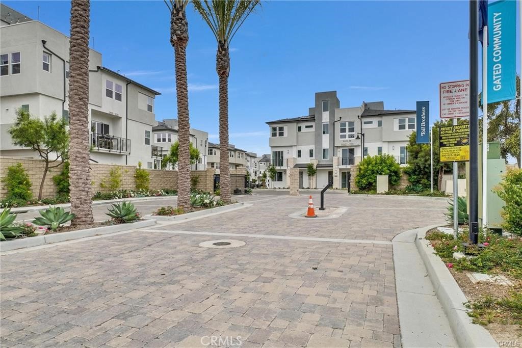 BEST LOCATION in the gated Community at 100 West in Anaheim. Just built in 2022 by the Toll Brothers and is nestled in the heart of Anaheim. It features 4 bedrooms and 3.5 bathrooms with a big rooftop. it is the most desirable floor plan. Entering the home, you will find a bedroom and a full bathroom on the first floor. The living room and kitchen are on the second floor. The gourmet kitchen features white cabinets, large center island , and stainless steel kitchen appliances. Third floor features one master suite and two bedrooms. Fourth floor is the rooftop with beautiful night! Condo comes complete with solar! Enjoy resort style living in this community that offers pool, spa, and BBQ/picnic area. Conveniently located just off the 5 Freeway, minutes from Disneyland, Angels Stadium, and Honda Center. Easy access to Anaheim Packing District, shopping, restaurants and much more!