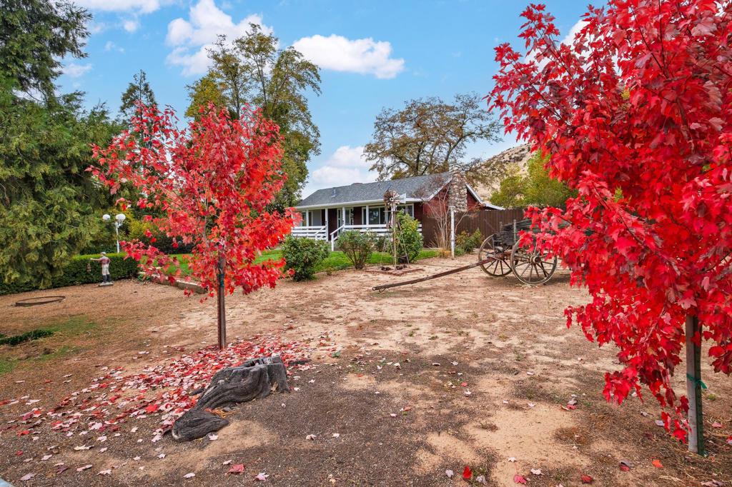 A picturesque Cottage with almost 2 ac lot - a peaceful retreat, a picture-perfect location at the end of cul-de-sac, with spacious outdoor spaces and beautiful mature trees. The property boasts stunning views of the San Jacinto and San Gorgonio Mountain Peaks. The warm and inviting Cottage features a lovely front porch, cozy fireplace, vintage details throughout, and plenty of natural light. Located in the desirable Banning Bench on a quiet County-maintained paved street, this gem has so much to offer. You'll enjoy 1.74 acres of horse property with ample space. Some of the upgrades include-New roof (2014), New hardi-board siding & new retrofit windows (2024) and more. Experience the exceptional rural atmosphere while enjoying easy access to I-10. You'll love the cooler summer temperatures, light breezes, seasonal changes, fresh air, and beautiful maple leaves that welcome the Fall.