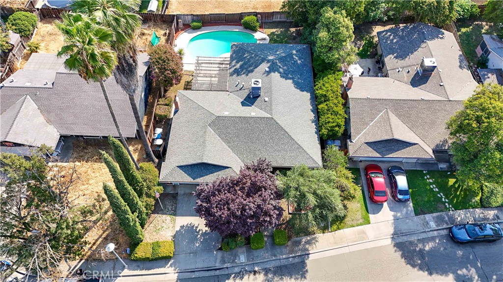 Welcome to a fantastic opportunity, a blank canvas to make improvements in North Merced! This spacious single-story home offers 1,981 sq. ft. of living space and features 4 bedrooms and 2 full bathrooms, in an established neighborhood cul-de-sac with established trees and low maintenance yards.
Inside, you'll find an open and functional layout with a comfortable living room up front, and a separate family room open to kitchen and dining room — ideal for hosting gatherings, spreading out with loved ones, or great for having separate living areas ideal when two different things are going on in one household and everyone needs their own space... The kitchen is open to dining room and family room and has already been updated with beautiful granite countertops and a functional and convenient dining bar, providing a great space for quick meals, extra prep space, or casual entertaining. Kitchen window is a pass through window with shelf/bar outside under patio for handing out snacks and drinks to swimmers and patio dwellers.
Step outside and imagine relaxing under the large arbor-style covered patio or enjoying sunny days in your fenced-in pool — the perfect place for a quick attitude adjustment during Merced’s hot summer months!
While the home has solid bones and several updates already in place, it does offer a unique opportunity for a buyer who’s ready to add value through minor cosmetic improvements. Whether it's fresh paint, flooring updates, or personal style upgrades, there's room here to make it truly your own now or over time.
Another plus is the recently purchased Heat and A/C system for added comfort and peace of mind.
Located just minutes from UC Merced, major shopping centers, many popular dining spots, and right around the corner from highly desirable Peterson Elementary School, this home checks all the best location boxes.
Perfect for a first-time buyer or someone looking for a well-priced home with room to personalize and make it your own. This is your chance to invest in a great neighborhood and build equity along the way. Perfect for a FHA 203K Rehab Loan. Ask your lender how to wrap your repairs into your loan. Home to be sold AS IS.