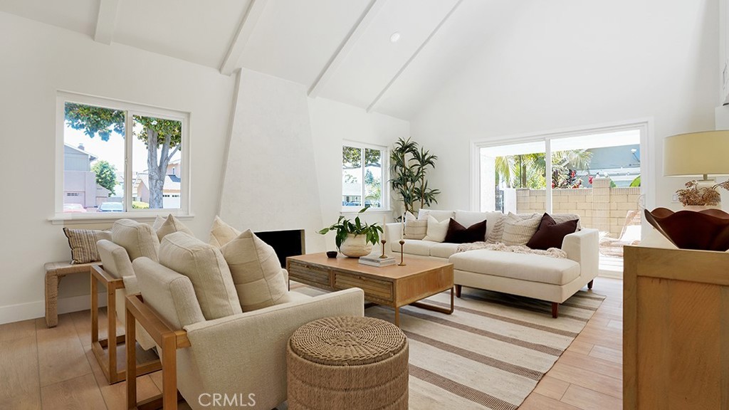 Welcome to this beautifully remodeled home where modern comfort meets timeless style. Bathed in natural light and finished with a warm neutral palette, this thoughtfully designed residence offers a seamless flow between living, dining, and work spaces—perfect for today’s lifestyle.
Step inside to soaring vaulted ceilings, exposed beams, and a striking tile-clad fireplace anchoring the bright and airy living room. Do NOT miss the HIDDEN room behind the feature wall under the stairs The open-concept floor plan extends to an inviting dining area with its own fireplace and adjacent dry bar, ideal for entertaining.
The remodeled kitchen features clean lines, sleek hardware, and ample cabinetry, with views of a private courtyard perfect for morning coffee. A spacious downstairs room with floor-to-ceiling windows opens directly to the patio, creating an ideal work-from-home sanctuary.
Upstairs, tranquil bedrooms offer generous proportions and abundant light. The bathrooms have been tastefully updated with modern vanities, designer tilework, and stylish fixtures, creating spa-like retreats throughout the home.
Additional upgrades include a brand-new water heater, dual-pane windows, and updated lighting throughout. Warm wood-toned flooring ties the home together with a fresh, cohesive aesthetic.
Ideally located just minutes from shopping, dining, parks, and beaches, this turnkey property blends sophistication with laid-back California living.