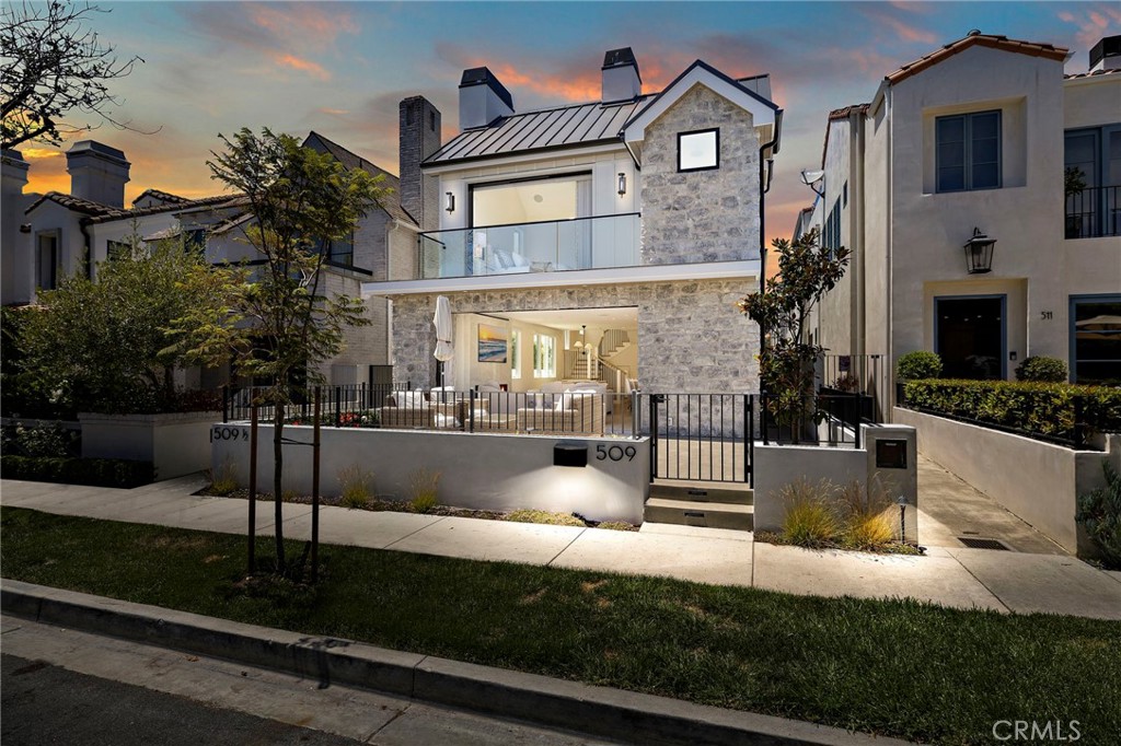 Magnificent new construction home, highly upgraded and landscaped, available for rent on perhaps the most beautiful of all Flower streets and in the best location. Walk to countless restaurants, the beach, grocery stores, beauty salons, banks, design and hardware stores and enjoy scenic walkways. For travel convenience, John Wayne Airport is just up MacArthur. Located south of Pacific Coast Highway, one often hears sea lions late at night but no sound from Pacific Coast Highway. Additionally, every surrounding home is stunning. Begonia Park - just over a block away, and Old School Park even closer. From the primary bedroom balcony, there is a peekaboo view of the ocean. From the top deck, there is added quiet, privacy and night sky viewing. Enjoy the front patio as a social point throughout the day and evening or open the enormous LaCantina doors that disappear 100% into the wall both upstairs and down for a completely open feel to the home. There is a downstairs bedroom or office and a private side patio separated from the front. This home is fully furnished in cream & white colors with all new down filled furnishings by Butera Designs for an effortless move in. Please, no pets and no occasional pet visitors either. There are numerous upgrades the owner painstakingly added, including but not limited to a top of the line drinking water and instant boiling water system, designer installed hardwired ceiling fans, top down bottom up blinds and interlined LaLique Designer made custom drapery; two separate Central Vacuum systems - a rarity in homes and a quiet convenience - one for the garage & car and one for inside; Mount Blanc quartzite counters, island and full backsplash; Italian porcelain laundry room and floor to ceiling on the wall to the fireplace and custom installed Samsung 77” Frame television; wrought iron exterior wall and entry gate; undercabinet dimmable lighting, custom all designer lighting; entire house inside and out on dimmers. In addition, there are three thermostat zones throughout the house for individualized heating and cooling; a tankless water system; electric vehicle built in charging station; rooftop solar; 36” wide built in Sub Zero refrigerator plus freezer; commercial Wolf stove & oven. One car garage and carport. Although this magnificent home is available for lease, the owner is open to the possibility of a sale with the right offer.