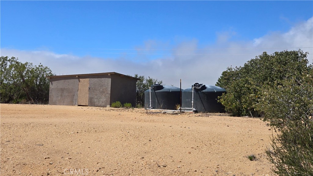 WATER and POWER. This 4.49 acre property is completely fenced and gated. Lots of privacy. Panoramic views of the valley and mountains. Two large pads. 2 water storage tanks and an oversized well pump house/storage shed. According to seller the well produces 25 gallons per minute. Very private and serene. Areas of native vegetation with wide open spaces in between. Great parcel for building a home or improved horse property, farm or ranch. Zoned Rural Residential so you can build your dream home for the peace, quiet and starry nights, but allows for plenty of work from home business opportunities. Living in Anza offers a suburban rural mix feel and affordable home ownership. Children, chickens, horses, goats, farming and gardening and more is doable here. Hiking and riding trails abound. 4100+foot elevation with mild four-season weather including a few snow days per year. The hamlet of Anza boasts of a casino, motocross, several restaurants, Dollar General store, grocers, farmers market, bank, pharmacy, medical clinic. K-12 schools, public and private. Find moderate electric rates & award winning internet, low property taxes. just minutes away from Highway 371 for the commute up or off the hill.****OWNER MAY CARRY WITH 50% DOWN****