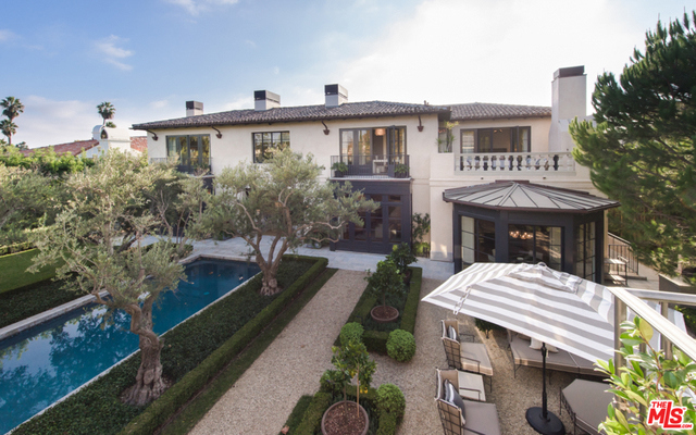 Welcome to 144 N Woodburn, located in the highly coveted and guard gated, Brentwood Circle. Stunning French Provincial Estate, designed by renowned, William Heffner. Every element of this home was masterfully thought through; from the book-matched marble slabs in the kitchen and master bath, custom-made steel French doors and windows to the "Waterwork" and "Compass" fixtures. Details such as stone from "Exquisite Surfaces", Mahogany windows & doors, "Savant" & "Lutron" smart technologies add to the luxury. Property boasts living room, dining room, junior dining room, family room, library, office, gym, world-class 7000 bottle wine cellar, 15 person screening room, butler's pantry/bar, covered veranda, 2 terraces, and a 6 car collector's subterranean garage. The stunning pool is encompassed by olive trees, surrounded by a lush lawn and leads to a private guest house that features a full gym on the top floor. A true masterpiece!
